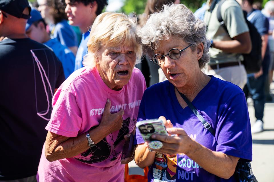 Celeste McCall, left, and Nan Raphael react to the US Supreme Court’s opinion on presidential immunity shortly after it released on July 1, 2024 in Washington, D.C.