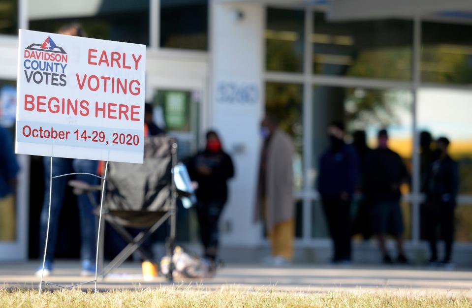 People wait in line to vote early in Nashville in the 2020 presidential election.
