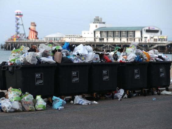 Waste ready to be collected on Bournemouth beach (PA)