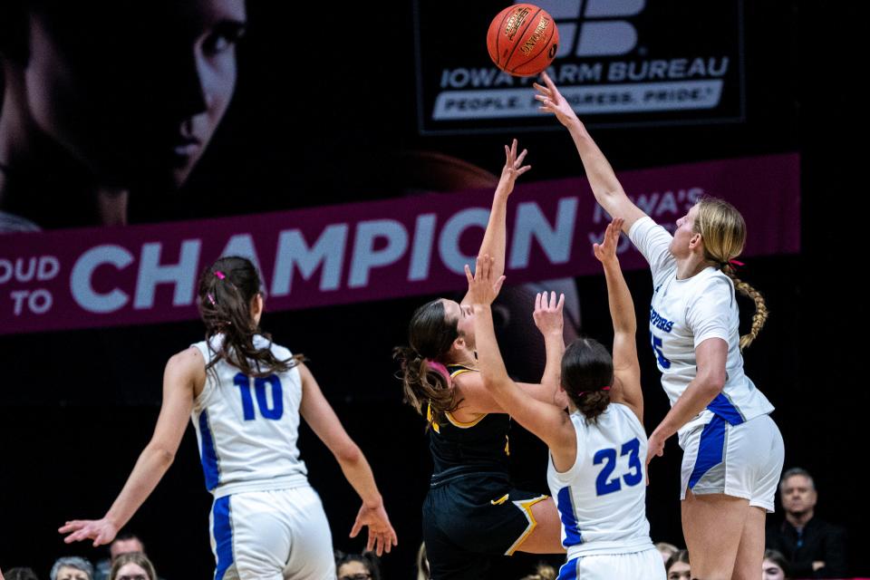 Clear Creek-Amana's Ava Locklear blocks a shot from Waverly-Shell Rock's Brenna Bodensteiner during the Iowa high school state tournament championship game at Wells Fargo Arena on Saturday. Locklear finished with four blocks while Beck tallied a team-high six blocks.