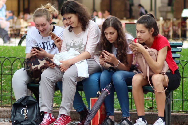 Teen girls sit on a bench and stare at their cellphones. According to a new survey, released Monday by the Pew Research Center, U.S. teens continue to use online platforms at high rates with many using YouTube, TikTok, Snapchat and Instagram “almost constantly,” despite growing concerns about the impact of social media. Photo by ghcassel/Pixabay

link back to: https://pixabay.com/photos/girls-cell-phones-sitting-3481791/