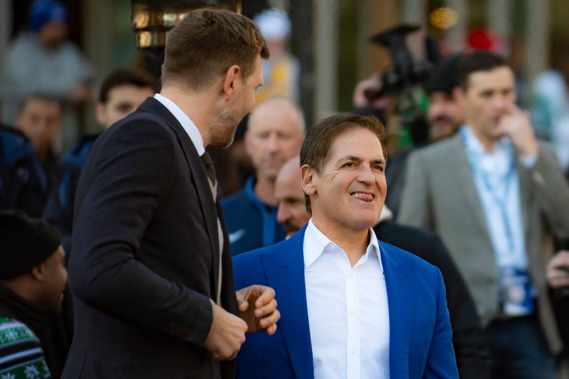 Dallas Mavericks owner Mark Cuban smiles as Dirk Nowitzki’s statue is unveiled during the “All Four One” statue ceremony in front of the American Airlines Center in Dallas, Sunday, Dec. 25, 2022. (AP Photo/Emil T. Lippe)