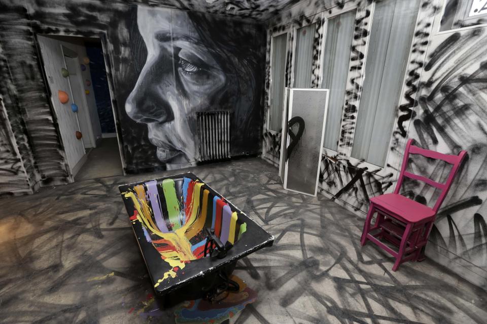 A bathroom painted by British street artist David Walker is seen at the street art project tower "Paris Tour 13" in Paris