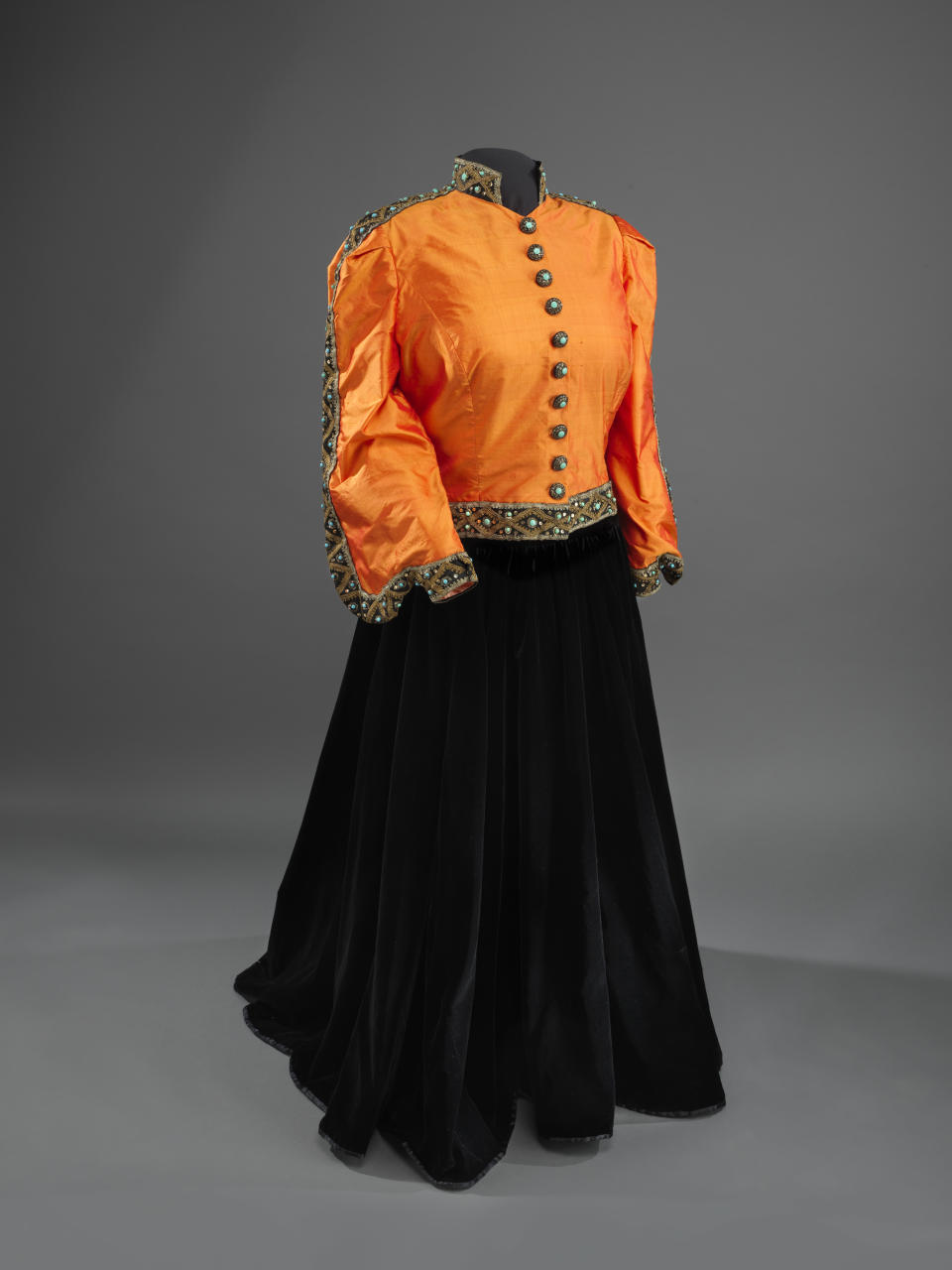 This undated handout photo provided by the National Museum of American History shows a Shantung silk jacket, redesigned in 1993, and black velvet skirt worn by Marian Anderson during her historic performance on the Lincoln Memorial in Washington in 1939. For the first time, Anderson’s orange-and-black blouse and skirt ensemble that she wore during her historic performance on the Lincoln Memorial steps 75 years ago will go on display at the Smithsonian. Anderson was a groundbreaking opera singer but was kept out of Washington’s Constitution Hall because she was black, and Eleanor Roosevelt invited her to perform at the Lincoln Memorial instead. The concert attire is part of a collection being donated to the National Museum of African American History and Culture by a member of Anderson’s extended family to mark the anniversary of Anderson’s concert on Wednesday. It will be displayed beginning Tuesday and will remain on view until September. (AP Photo/Hugh Talman)