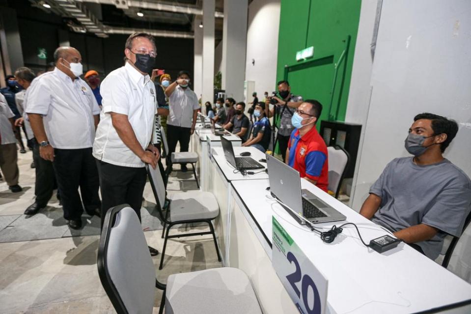 Johor Mentri Besar Datuk Hasni Mohammad (second left) is seen during yesterday’s visit to review final preparations for the opening of the Mid Valley Southkey mega PPV in Johor Baru July 19, 2021. — Picture courtesy of the Johor Mentri Besar’s Office