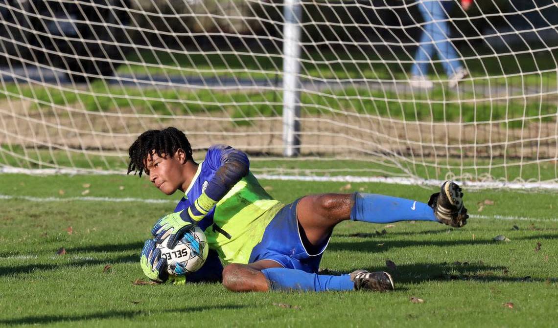 Clovis High junior goalkeeper Niles West pounced on a shot by Clovis North during a TRAC soccer match at Clovis Community College on Jan. 18, 2023. The state’s top-ranked boys team, Clovis North, scored a 2-1 win.