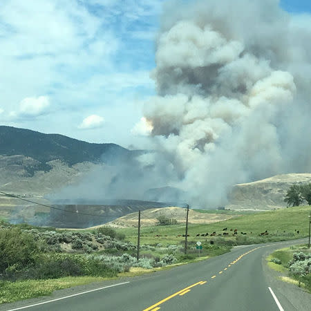 Smoke rises over the landscape in Ashcroft, British Columbia, Canada July 7, 2017. Picture taken July 7, 2017. Mandatory credit TWITTER/@joeandsue/Handout via Reuters ATTENTION EDITORS - THIS IMAGE WAS PROVIDED BY A THIRD PARTY. MANDATORY CREDIT. NO RESALES. NO ARCHIVE.