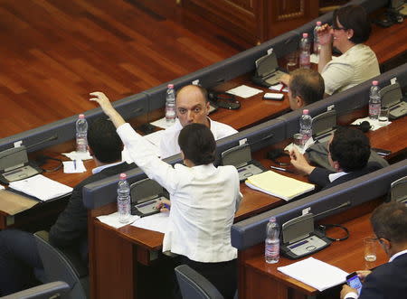 Kosovar Members of Parliament sit in the Assembly during a summer session in Pristina, Kosovo August 3, 2015. REUTERS/Hazir Reka