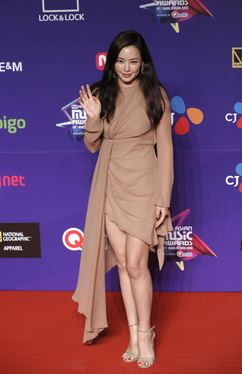 South Korean artist Lee Ha-nui poses for photos on the red carpet of the Mnet Asian Music Awards (MAMA) in Hong Kong, Friday, Dec. 1, 2017. (AP Photo/Kin Cheung)