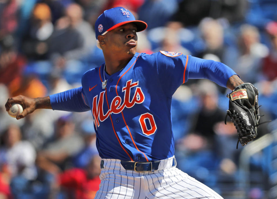 FILE - In this Feb. 28, 2020, file photo, New York Mets pitcher Marcus Stroman throws during the first inning of a spring training baseball game against the St. Louis Cardinals in Port St. Lucie, Fla. MLB pitchers are eager to fire some fastballs and spin a few breaking balls now that a semi-normal spring training has started. Coaches and executives are trying to make sure everyone stays healthy. (AP Photo/Jeff Roberson, File)