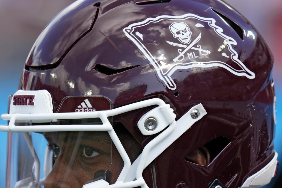 Mississippi State running back Jo'quavious Marks and the rest of the team wear stickers on their helmets in honor of former coach Mike Leach during the first half of the ReliaQuest Bowl NCAA college football game against Illinois Monday, Jan. 2, 2023, in Tampa, Fla. Leach passed away Dec. 13, 2022, from a heart condition. (AP Photo/Chris O'Meara)