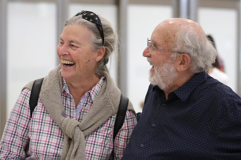 Swiss scientist Michel Mayor shares a laugh with his wife Françoise after landing at the Barajas airport in Madrid, Tuesday, Oct. 8, 2019. Mayor has been jointly awarded the 2019 Nobel Prize in Physics along with Professor Didier Queloz and Professor James Peebles for their pioneering advances in physical cosmology, and the discovery of an exoplanet orbiting a solar-type star. (AP Photo/Manu Fernandez)