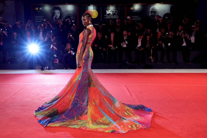 woman one the red carpet in a long gown