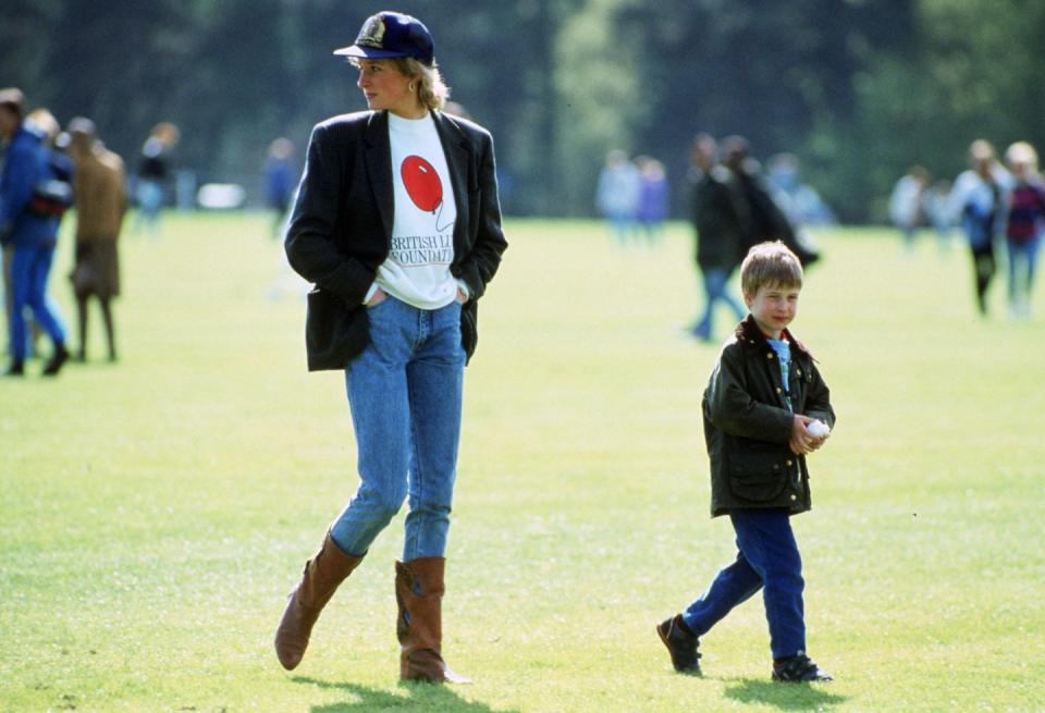 <p>Princess Diana kept it casual in jeans, a blazer, boots, and baseball cap during this outing. </p>