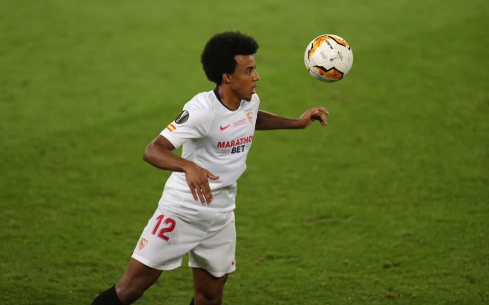 Sevilla's French defender Jules Kounde eyes the ball during the UEFA Europa League final football match Sevilla v Inter Milan on August 21, 2020 in Cologne, western Germany. - FRIEDEMANN VOGEL/POOL/AFP via Getty Images