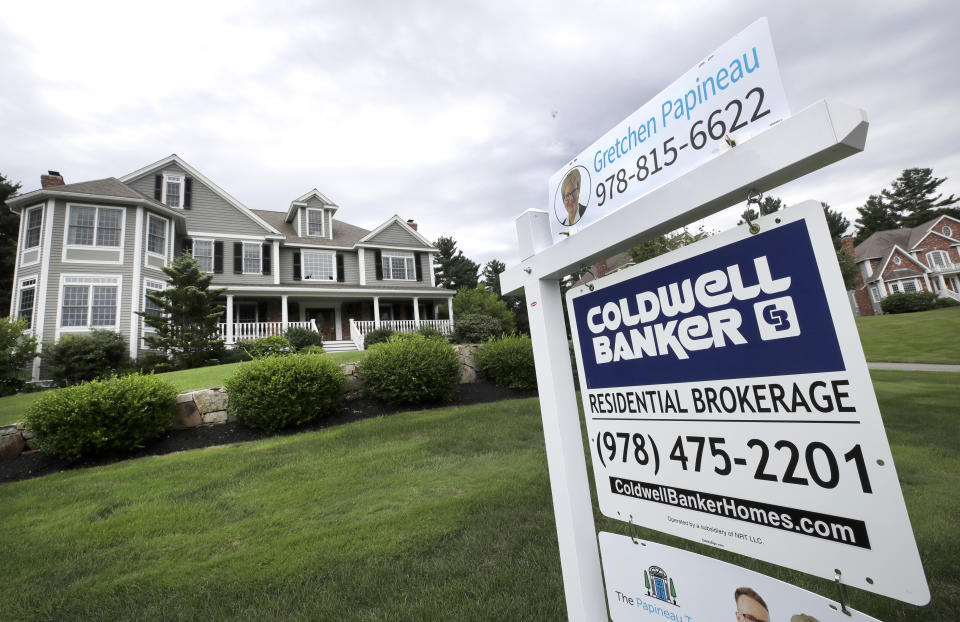 In this Monday, July 22, 2019, photo a sign advertises a home for sale in North Andover, Mass. On Thursday, July 25, Freddie Mac reports on this week’s average U.S. mortgage rates. (AP Photo/Elise Amendola)