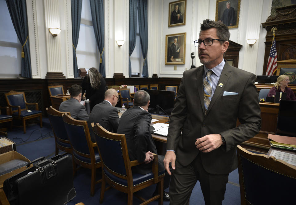 Assistant District Attorney Thomas Binger, right, enters the courtroom for the start of Kyle Rittenhouse trial at the Kenosha County Courthouse in Kenosha, Wis., on Thursday, Nov. 4, 2021. Rittenhouse is accused of killing two people and wounding a third during a protest over police brutality in Kenosha, last year. (Sean Krajacic/The Kenosha News via AP, Pool)