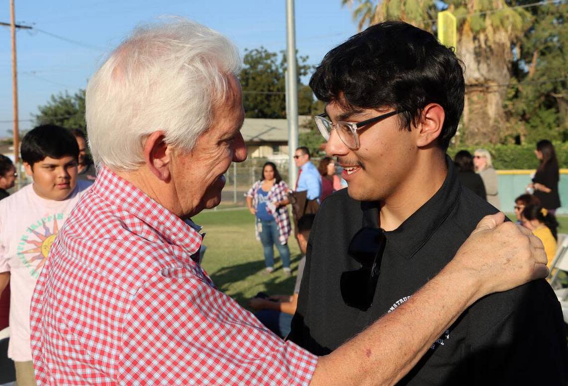 Congressman Jim Costa chats with Dinuba High School Construction Management Academy student Víctor Alcaráz after the academy got a gold certification from the Linked Learning Alliance.