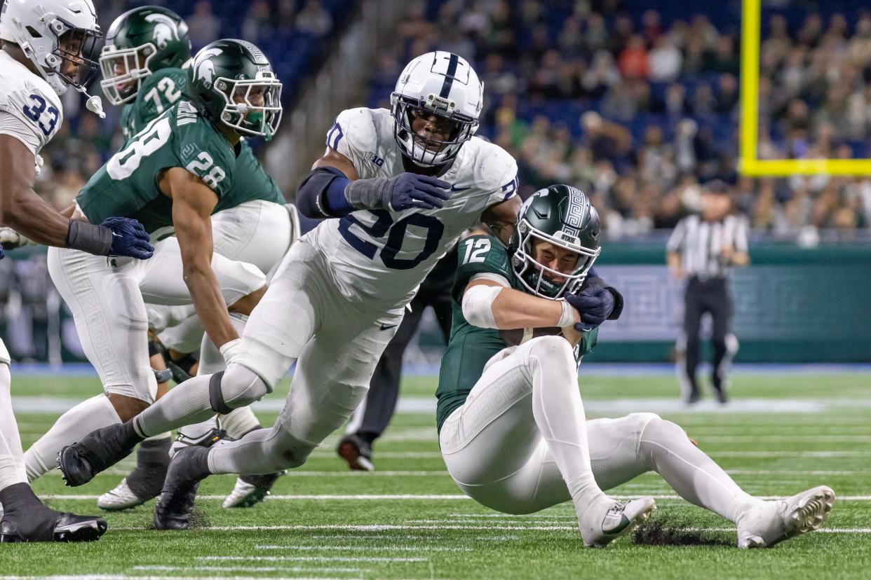 Nov 24, 2023; Detroit, Michigan, USA; Penn State Nittany Lions defensive end Adisa Isaac (20) pressures and sacks Michigan State Spartans quarterback Katin Houser (12) during the second half at Ford Field. Mandatory Credit: David Reginek-USA TODAY Sports