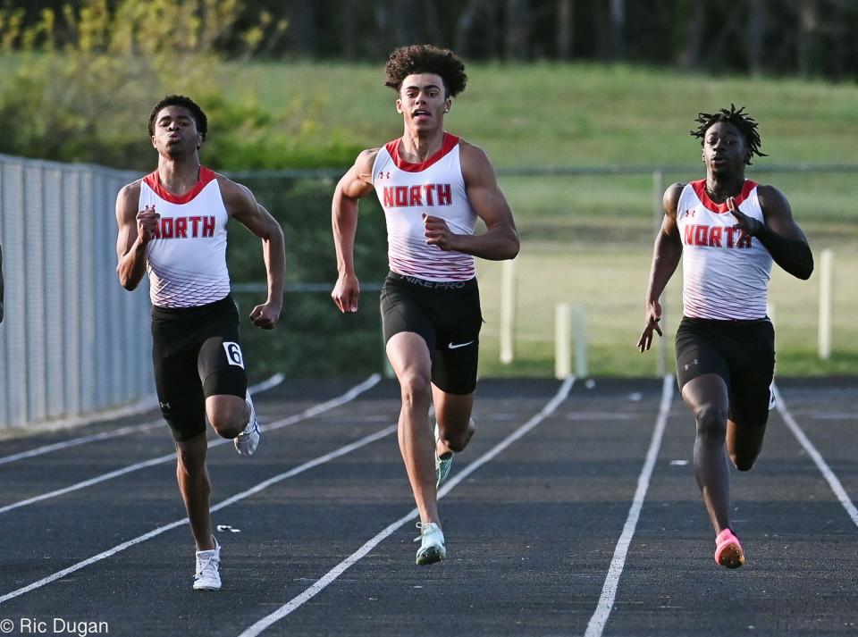 North Hagertown's Royce Naylor, middle, Mahamane Toure, right, and Ghe Hori Echols took the top three places in the boys 200-meter dash at the Washington County Track & Field Championships on Wednesday at Clear Spring.