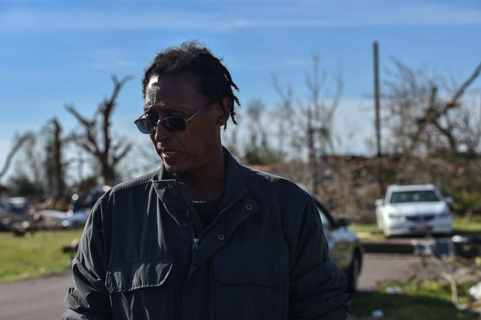 Willie Macon, 58, pauses in the morning light Monday following Friday's violent tornado in Rolling Fork.