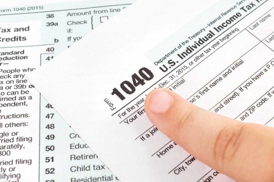 Finger pointing on tax form. Business concept.