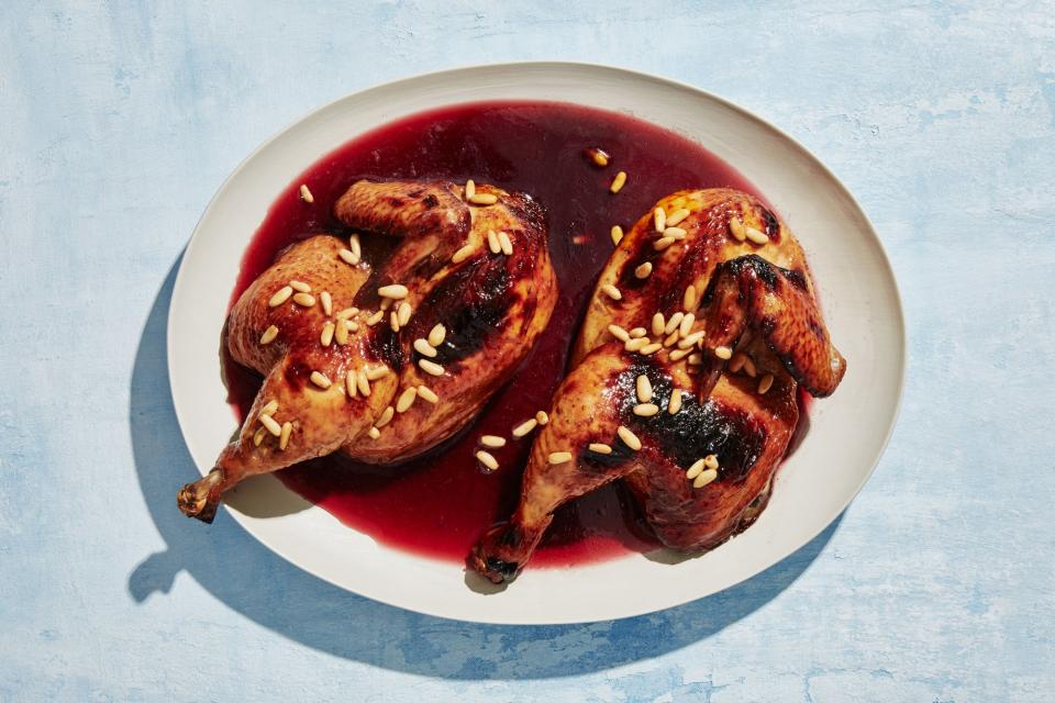 Chicken halves in a pomegranate bath.