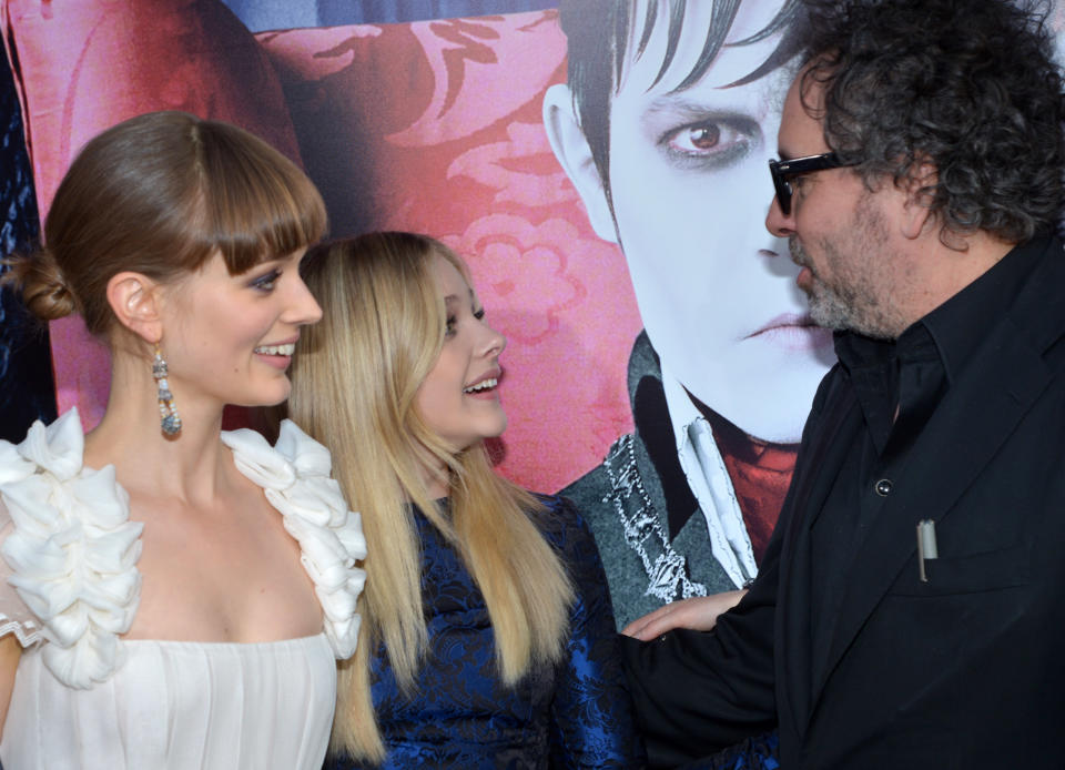 HOLLYWOOD, CA - MAY 07:  (L-R) Actresses Bella Heathcote, Chloe Grace Moretz, and director Tim Burton arrive at the Los Angeles premiere of "Dark Shadows" held at Grauman's Chinese Theatre on May 7, 2012 in Hollywood, California.  (Photo by Lester Cohen/WireImage)