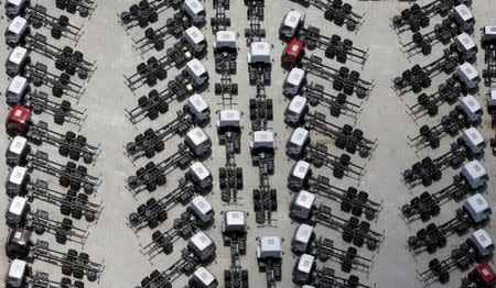 New Ford trucks are seen at a parking lot of the Ford factory in Sao Bernardo do Campo February 12, 2015. REUTERS/Paulo Whitaker/File Photo