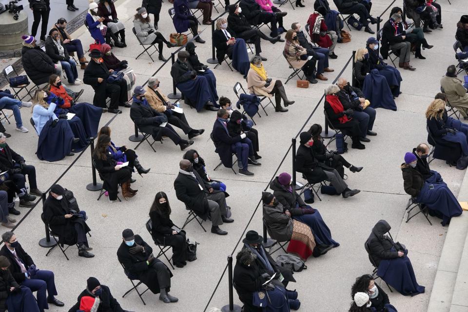 <p>A socially distanced crowd sits at the U.S. Capitol for the inauguration. </p>