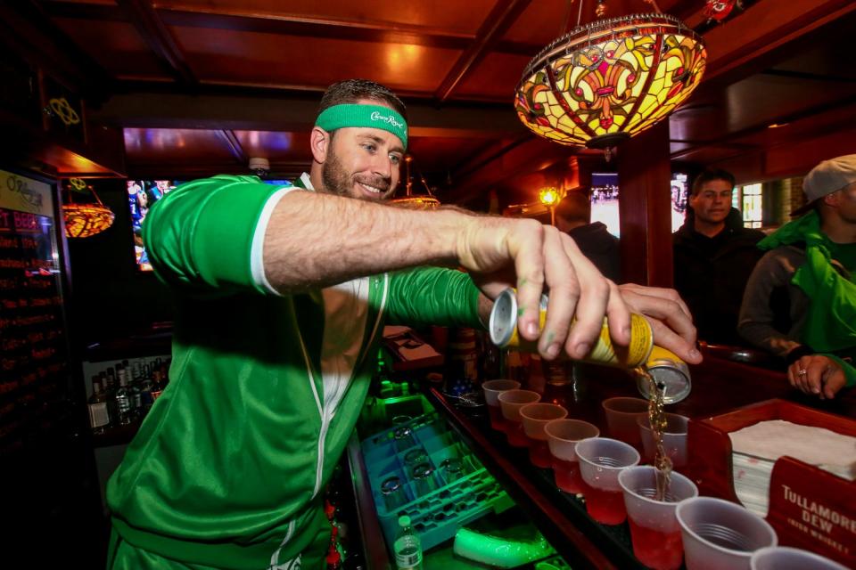 Hundreds of people make their way through downtown Pensacola during O'Riley's Irish Pub's 4th annual Grog March on Saturday, March 16, 2019. The event collected food and cash donations for Manna Food Pantries.