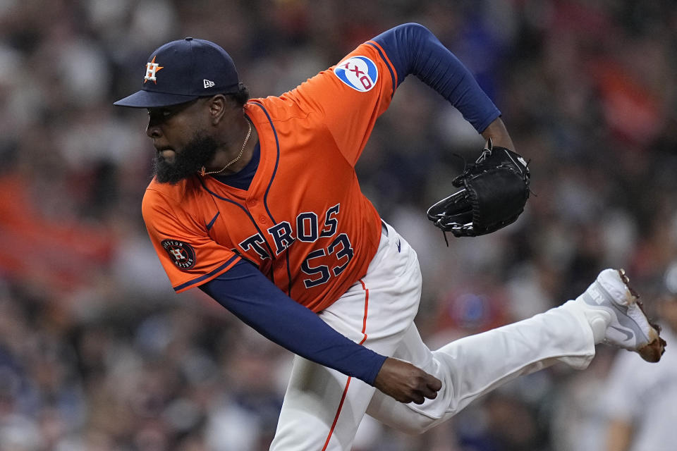 Houston Astros starting pitcher Cristian Javier watches a throw during the fifth inning of the team's baseball game against the New York Yankees, Friday, March 29, 2024, in Houston. (AP Photo/Kevin M. Cox)