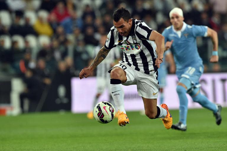 Juventus forward Carlos Tevez controls the ball during their Italian Serie A football match against Lazio in Turin, Italy, on April 18, 2015