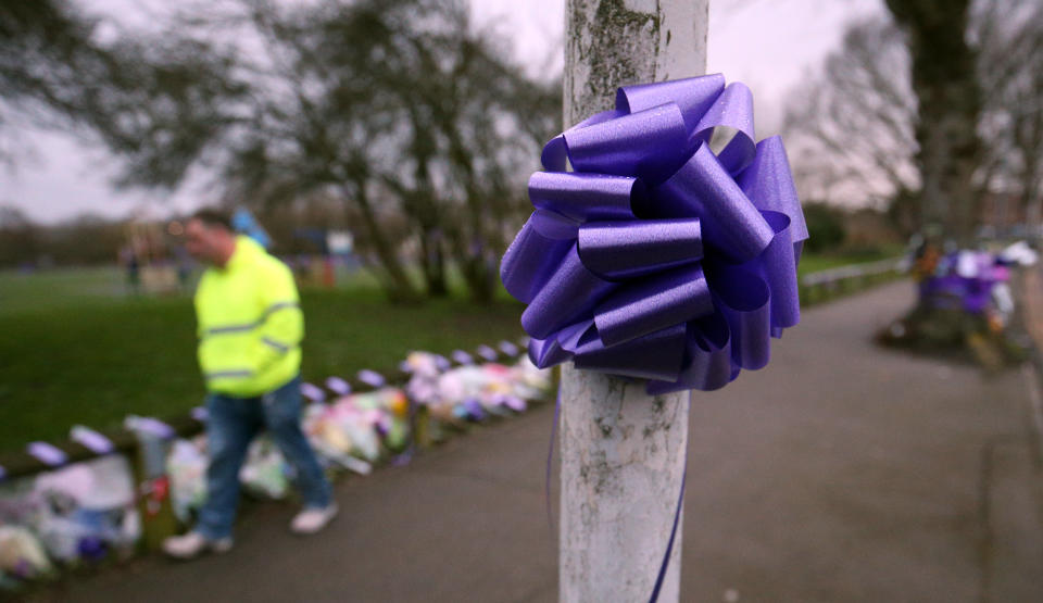 Purple bows and ribbons attached to lamp posts and railings in St Neot's Road, Harold Hill, east London, after the stabbing. (PA)