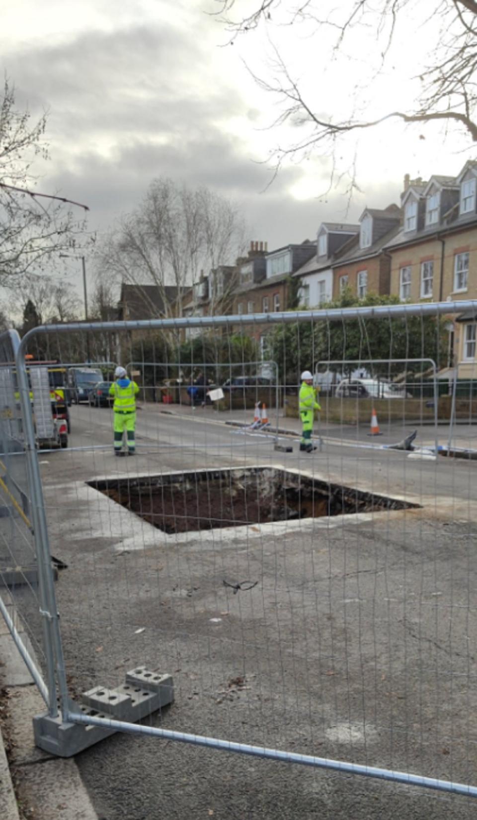 A sinkhole has closed a road in Teddington