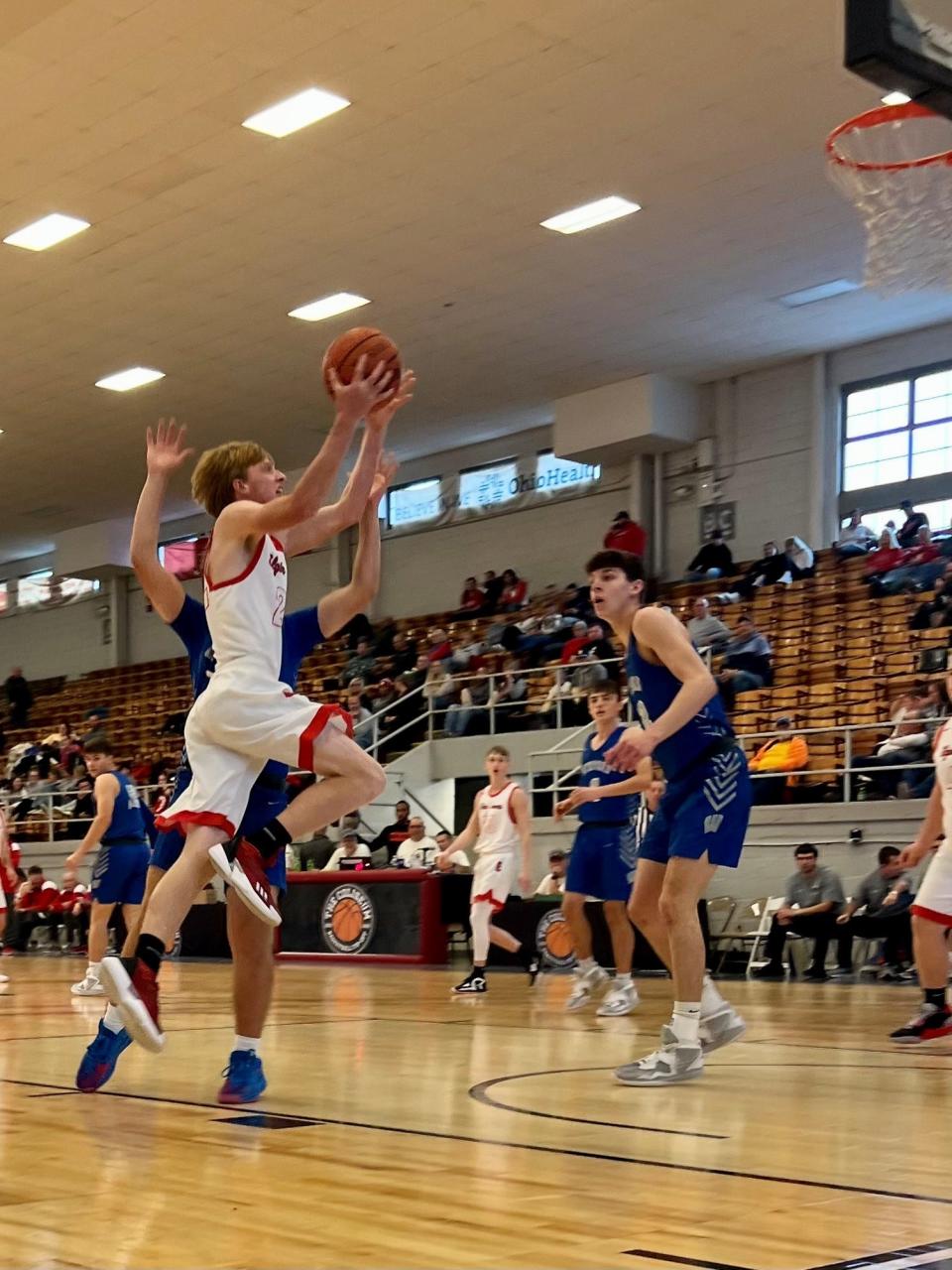 Elgin's Isaac Dillon drives for a layup against Wynford in a preview boys basketball game at the Coliseum Tip-Off earlier this season.