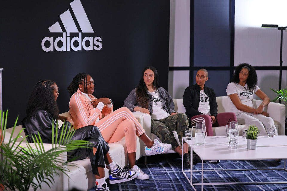 WNBA Adidas partners Candace Parker, Layshia Clarendon, Nneka Ogwumike and Natalie Achonwa join Arielle Chambers for a discussion around Adidas NIL network announcement and how the landscape is pushing the game forward for sport equality on April 3, 2022 in Minneapolis. (Adam Bettcher/Getty Images for adidas)