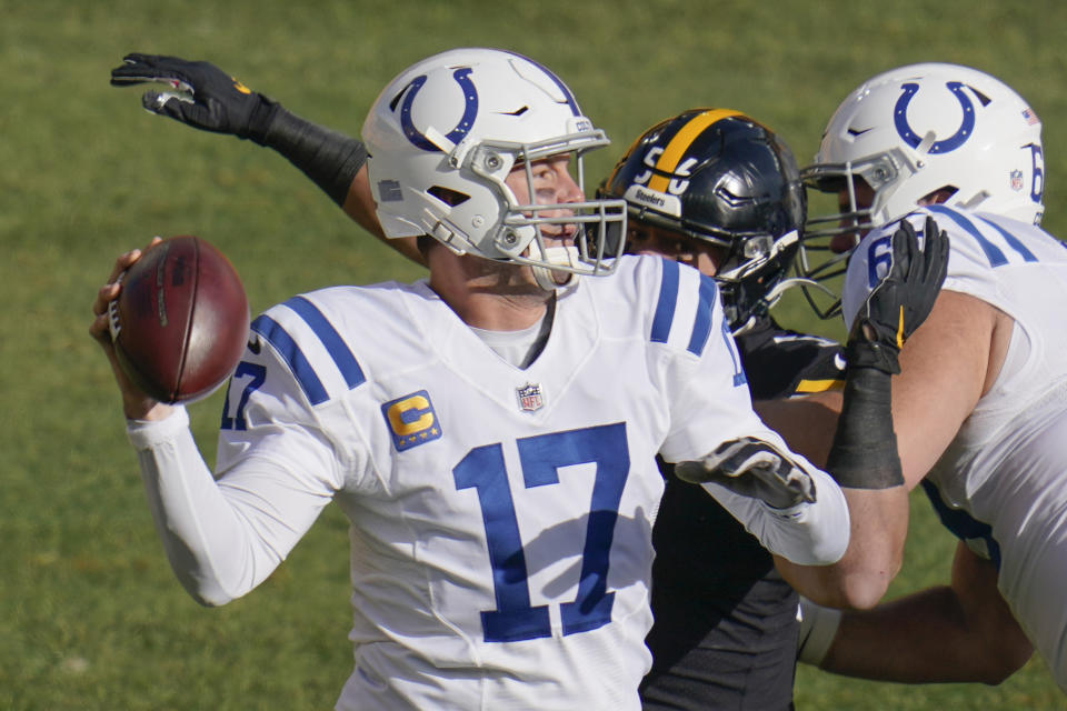 Indianapolis Colts quarterback Philip Rivers (17) gets off a pass as Pittsburgh Steelers linebacker Alex Highsmith (56) pressures him during the first half of an NFL football game, Sunday, Dec. 27, 2020, in Pittsburgh. (AP Photo/Gene J. Puskar)