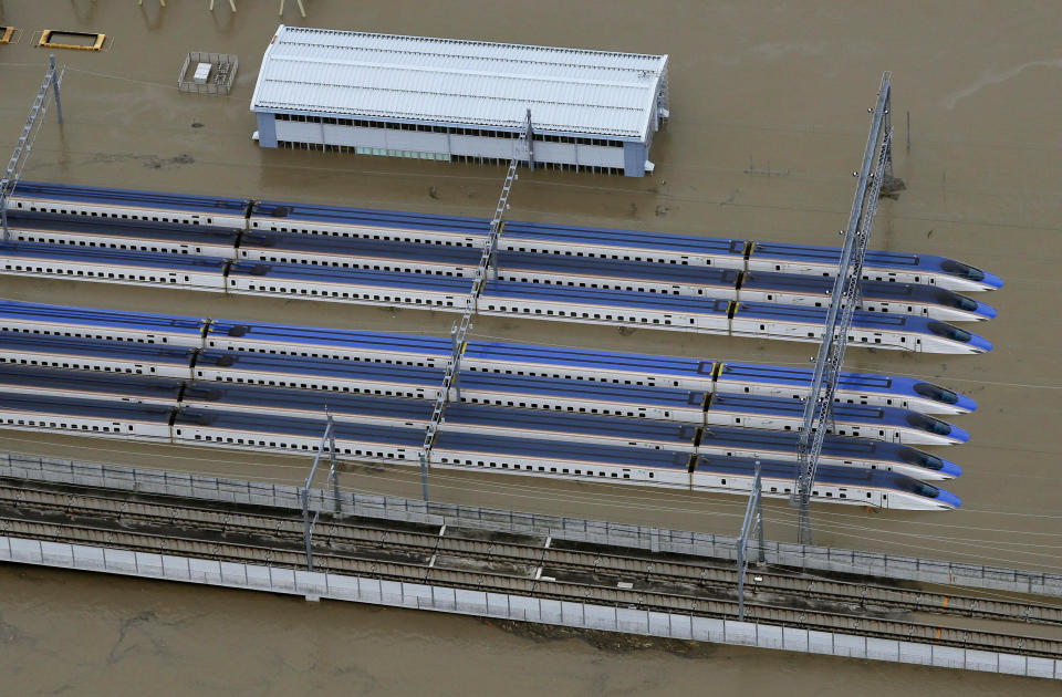 Rows of Japan's bullet trains, parked in a facility, sit in a pool of water in Nagano, central Japan, after Typhoon Hagibis hit the city, Oct. 13, 2019. (Photo: Yohei Kanasashi/Kyodo News via AP)