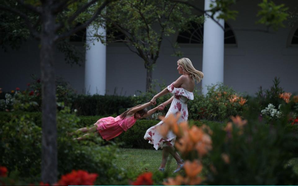 Ivanka Trump plays with her daughter Arabella Rose Kushner in the Rose Garden - Getty Images North America