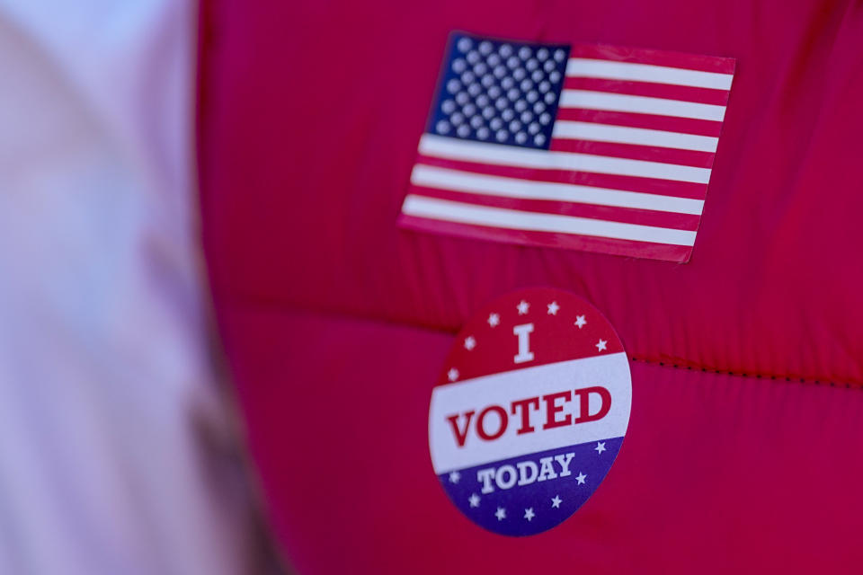 Ron Worley, candidate for Gaston county commissioner, displays an I Voted Today sticker on Super Tuesday at the entrance to a polling location Tuesday, March 5, 2024, in Belmont, N.C. (AP Photo/Chris Carlson)