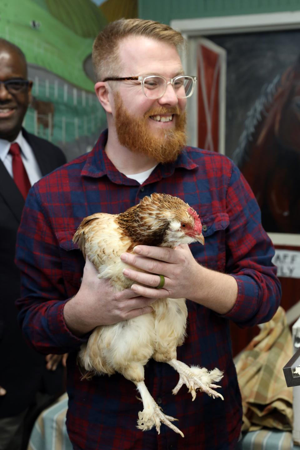 Muscoot Farm manager Jonathon Benjamin holds Cluxatawney Henrietta who predicted an early Spring by laying an egg, at Alfred B. DelBello Muscoot Farm in Katonah during a Groundhog Day celebration Feb. 2, 2024.
