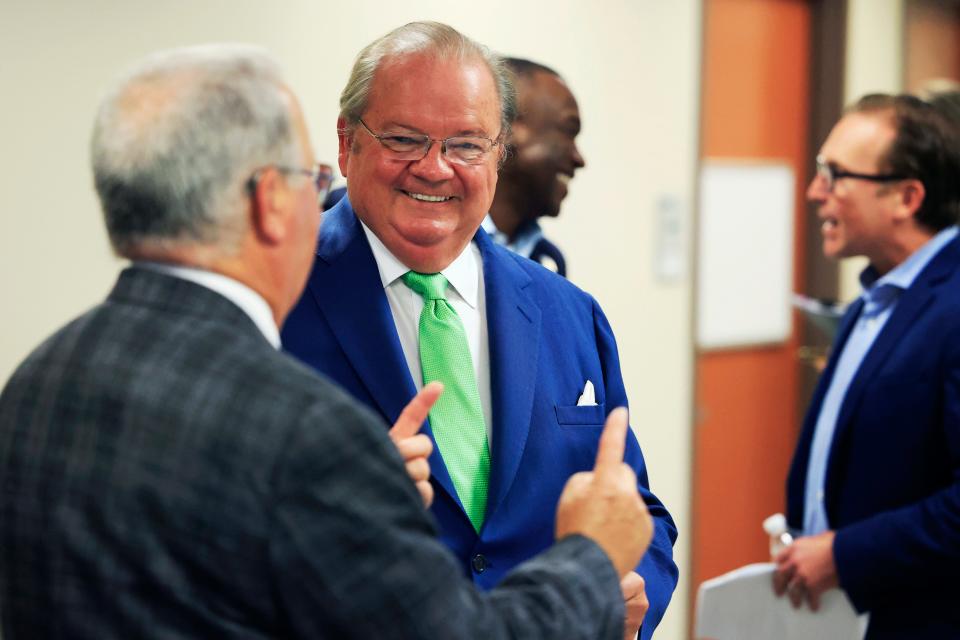 Nicholas Allard , dean of the Jacksonville University College of Law, greets  a guest at a celebration the college held Thursday to formally mark its debut. The school began holding classes for its first 14 students in early August.