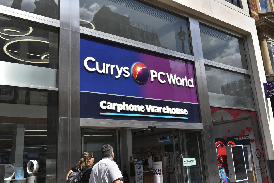 People walk past a Carphone store in Central London, on July 31, 2018. Dixons Carphone has apologised to all of its customers after revealing that a 2017 data breach affected personal data held in an additional 8.8 million customer records. The admission is the second revelation related to the data breach in six weeks and the third since 2015. (Photo by Alberto Pezzali/NurPhoto via Getty Images)