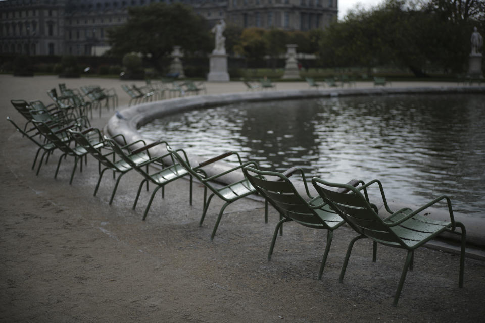 Empty chairs are pictured in the Tuileries gardens Wednesday, Oct.14, 2020 in Paris. French President Emmanuel Macron is giving a nationally televised interview Wednesday night to speak about the virus, his first in months. French media reports say Macron will also step up efforts on social media to press the need for virus protections among young people. (AP Photo/Lewis Joly)