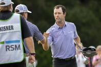 Robert Streb, right, fist-bumps Kevin Kisner after winning a second hole playoff at the RSM Classic golf tournament, Sunday, Nov. 22, 2020, in St. Simons Island, Ga. (AP Photo/Stephen B. Morton)