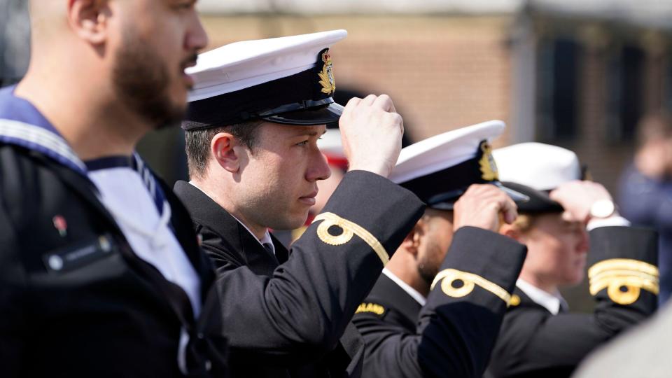 Members of the Royal New Zealand Navy replace their caps