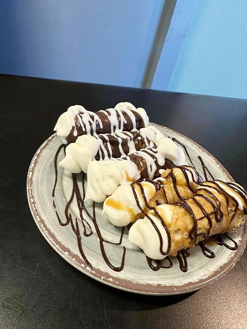 After winning Tre Raggazi's calzone challenge, YouTube star and competitive eater Adam Moran polished off these five cannolis.