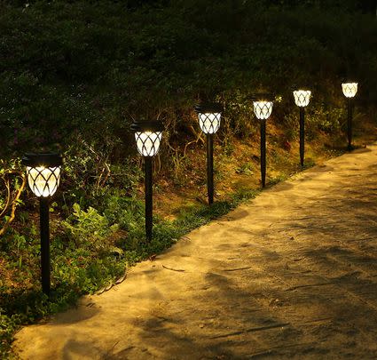 Use solar powered stake lights to keep the lawn well lit