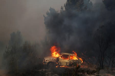 A car burns near at the small village of Vila de Rei